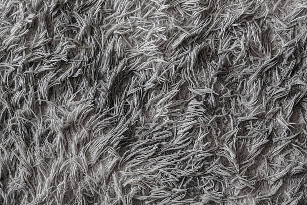 A soft, fluffy fabric with a textured, shaggy appearance, perfect for adding warmth and coziness to design projects.