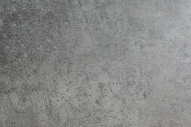 istock A textured, distressed wall with subtle imperfections and faint markings, perfect for adding a raw, industrial aesthetic to design projects. 2229401347
