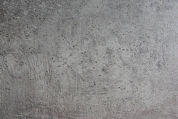 istock A textured, distressed wall with subtle imperfections and faint markings, perfect for adding a raw, industrial aesthetic to design projects. 2229401348