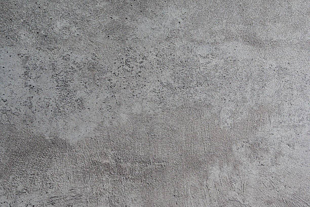 istock A textured, distressed wall with subtle imperfections and faint markings, perfect for adding a raw, industrial aesthetic to design projects. 2229401351