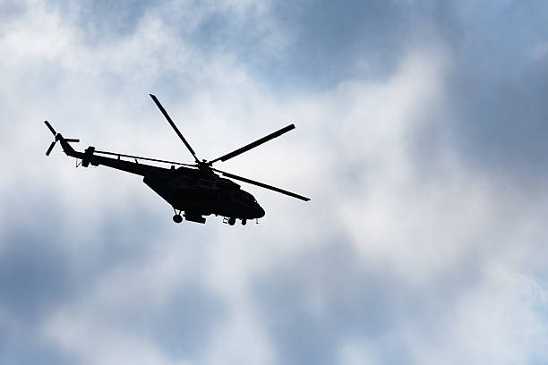 istock Silhouette of Mi-17 helicopter against the sky 2229401416