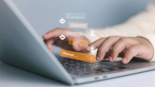 istock Artificial intelligence, virtual assistant, and technology innovation. Close-up of hands typing on laptop with AI chatbot interface and prompt text. 2229402604