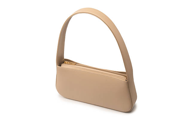 istock Beige women leather bag isolated on white background. 2229404617