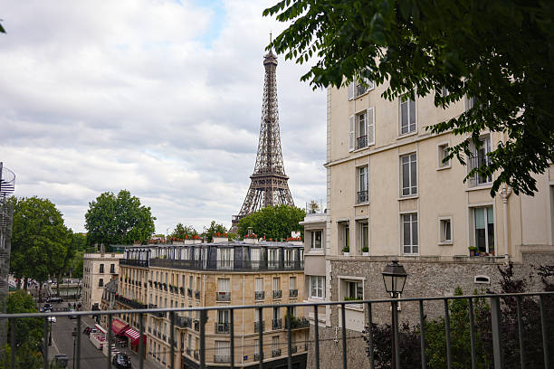 istock Eiffel Tower view from Parisian balcony on cloudy day 2229405692