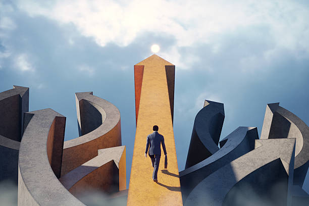 istock Businessman walking on straight arrow path towards success 2229407462