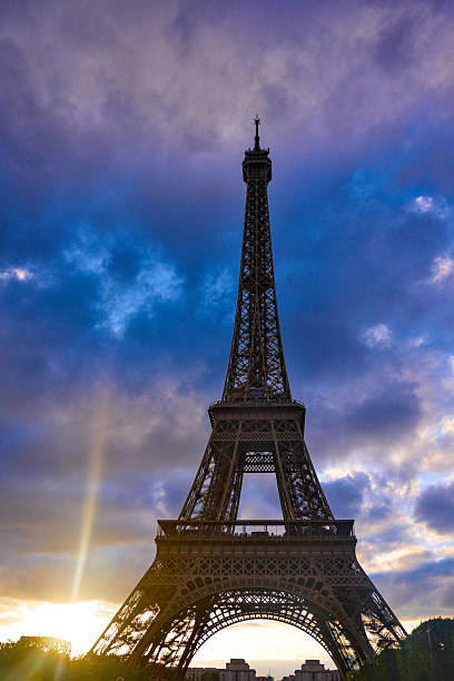 Eiffel Tower at sunset with dramatic clouds Paris France