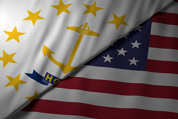 Close-up view of the Rhode Island state flag alongside the United States national flag. The vibrant colors and fabric texture highlight the unity and identity of the state within the nation.