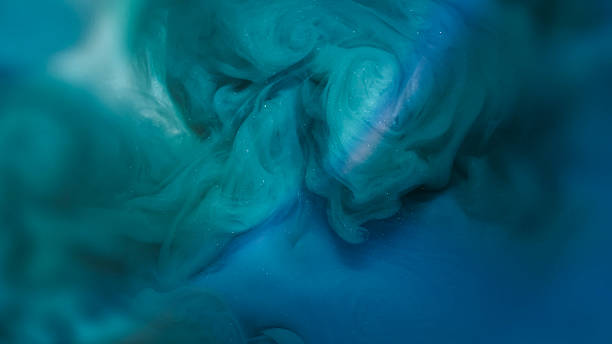 istock Atmospheric smoke shiny particle glitter ink water 2229409590