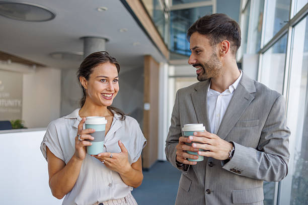 istock Business colleagues enjoying coffee break and engaging in friendly conversation 2229413821