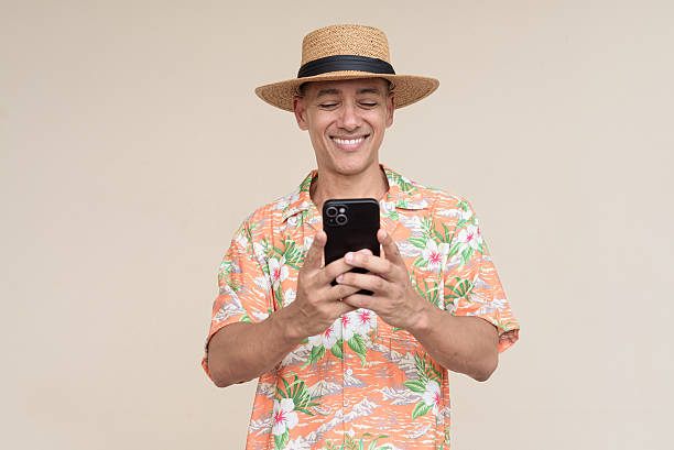 istock Smiling Hispanic Tourist Man Using Phone 2229417336