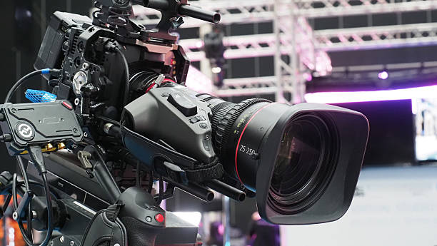 istock A professional video camera with a large zoom lens. 2229420693