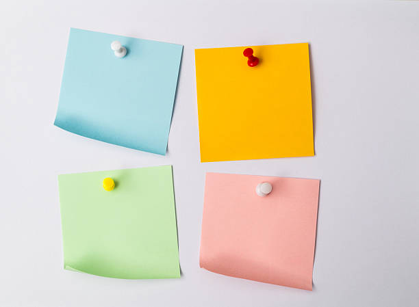 istock Four vibrant paper stickers with pins isolated on white background 2229421545