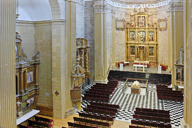 Interior of Santo Domingo de la Calzada Cathedral - a landmark on the historic Camino de Santiago pilgrimage route in La Rioja, Spain - featuring the ornate high altar, gilded retablo, and the tomb of Saint Dominic.