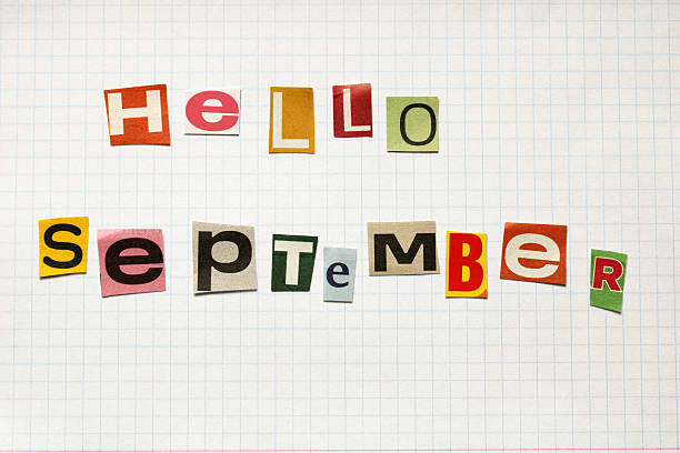 istock Hello september written with colorful newspaper cutout letters on graph paper 2229429150