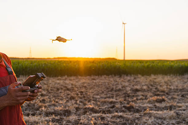 istock Farmer controls drone on a field. Smart farming and precision agriculture 2229433426