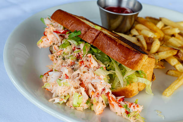 istock Gourmet Lobster Roll with Crisp Fries on White Plate 2229433539