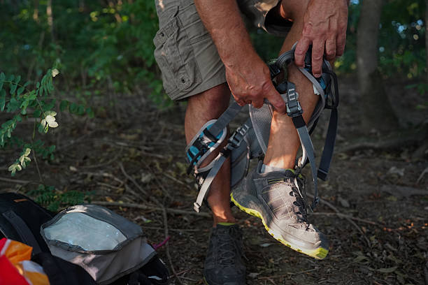 istock Climber preparing safety gear and harness before outdoor rock climbing 2229434426