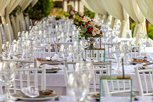 istock A long table set up for a wedding reception with white chairs and white tablecloths 2229436196