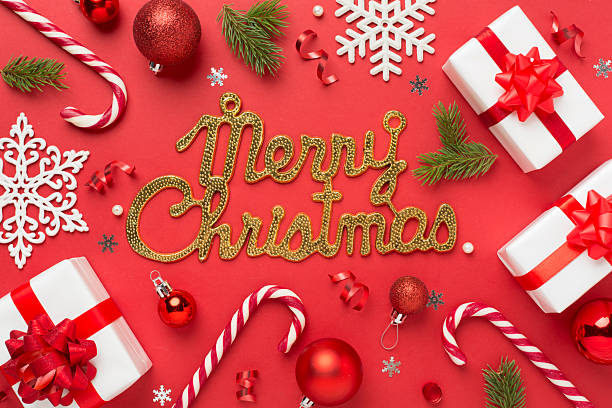istock Merry christmas text with confetti and decor on color background, top view 2229436412