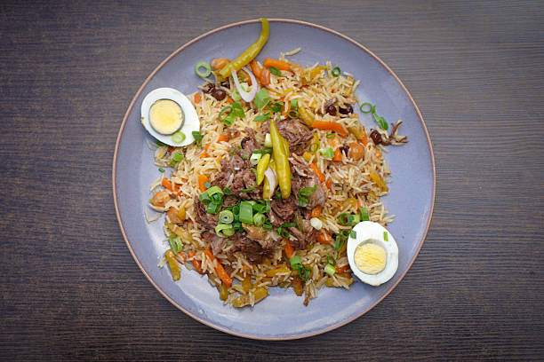 istock Plate of aromatic pilaf with boiled eggs and herbs 2229437171