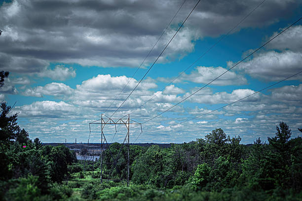 istock High-Voltage Transmission Tower in Natural Landscape 2229439646