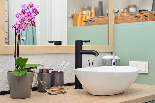 istock Stylish vessel sink with black basin mixer 2229443396