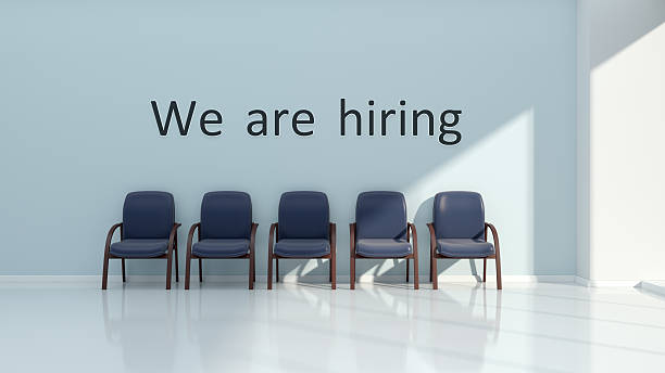 istock We are hiring. Interior with text and chairs on wall. 2229446950