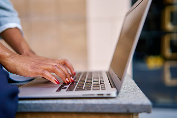 istock Businesswoman typing on laptop keyboard, working remotely 2229447477