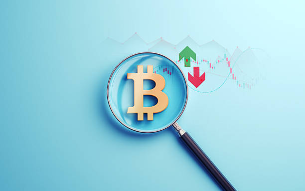 istock Bitcoin Gold Metallic Icon Selected with Metallic Magnifying Glass on Soft Blue Financial Background 2229448414