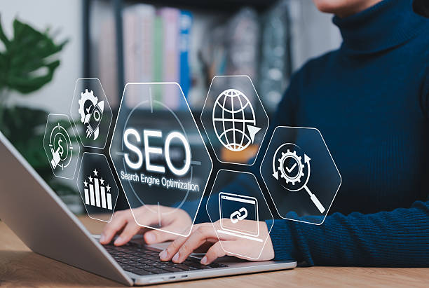 istock SEO Marketing and Search Engine Optimization Strategy Concept. Person using laptop with icons SEO, marketing tools, link building, keyword strategy, online analytics for digital growth and visibility, 2229452502