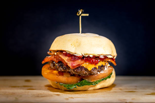 istock Bacon Cheeseburger with Lettuce, Tomato, and Cheddar Cheese 2229452998