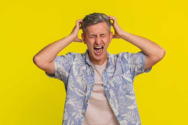 istock Man yelling with angry face waving hands in rage during argument showing strong emotional outburst 2229453040