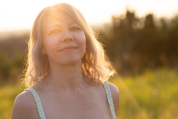 istock Woman Enjoying A Peaceful Moment Outdoors During Golden Hour 2229454614