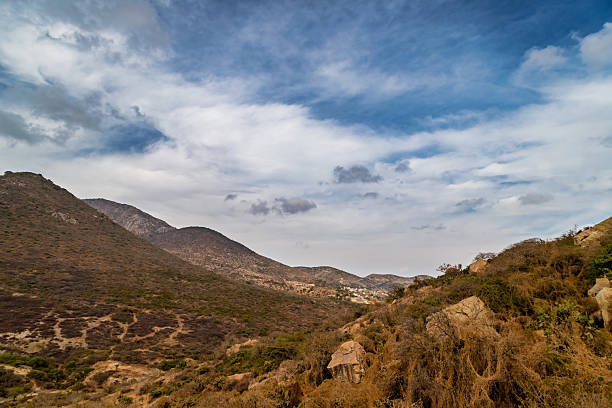 Arid mountain landscape with rocky terrain and sparse vegetation in Bernal, Mexico