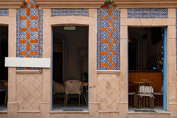 Colorful chairs and barrel table on mexican plaza