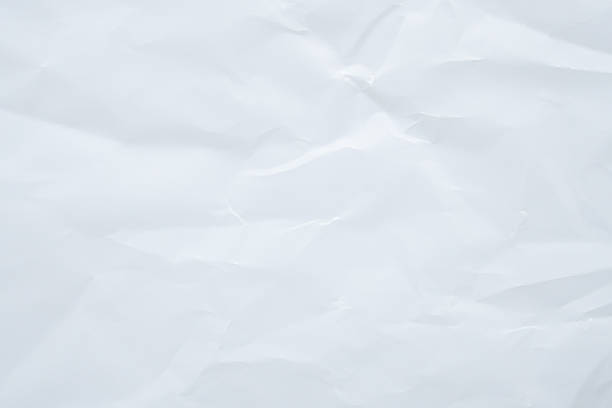 istock Abstract white crumpled and creased recycle paper texture background 2229457852