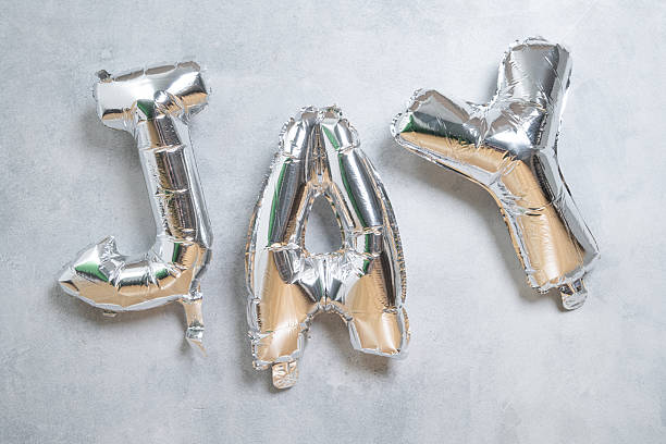 Silver balloon letters spelling jay for party decor and celebrations