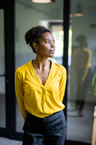 istock Confident businesswoman looking away in modern office 2229457974