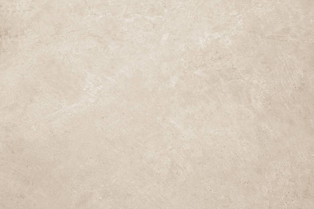 istock Concrete wall texture background. Close up retro plain cream color cement wall background texture. 2229462409