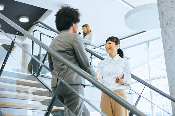 istock Employees engaging in a business conversation 2229463142