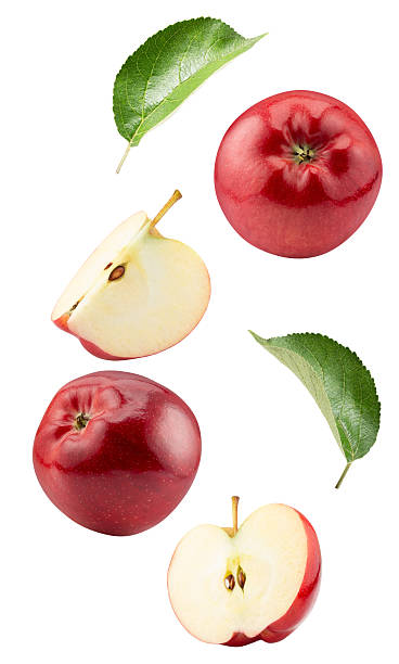 istock falling red apples with slices and leaves isolated on white background 2229463826