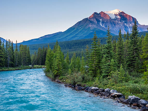 istock Turquoise river winding through forest with Mount Temple in Banff National Park 2229466827