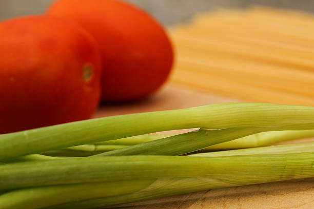 istock Pasta dinner ingredients on wooden cutting board 2229468083