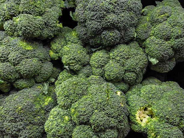 istock Fresh broccoli heads piled together at market 2229468632