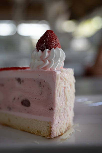 istock A pink strawberry cake slice with fresh strawberries on top 2229468964