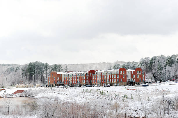 istock apartment building in winter after snow 2229471415