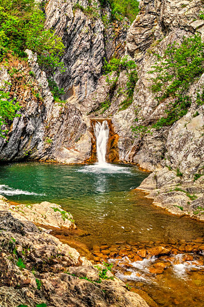 istock Landscape with waterfall in the mountain 2229478376