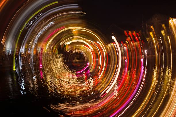 istock Mesmerizing Multicolored Light Trails Forming a Beautiful Whirlpool in the Dark Night Sky. 2229479024