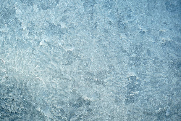 istock ice crystal background on the window in winter 2229481587