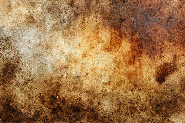 istock Abstract brown and orange grunge texture with scattered spots and stains 2229485488